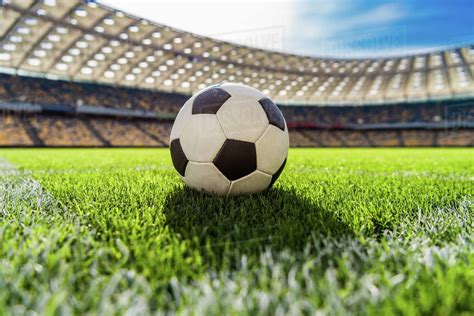 Close Up View Of Soccer Ball On Grass On Soccer Field Stadium Stock