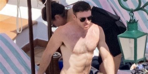 Richard Madden Relaxes Shirtless Poolside On Vacation In Italy