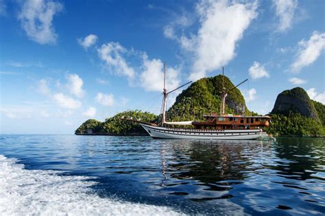 Sail Boat Between Islands Of Remote Archipelago Pulau Wayag Raja Ampat