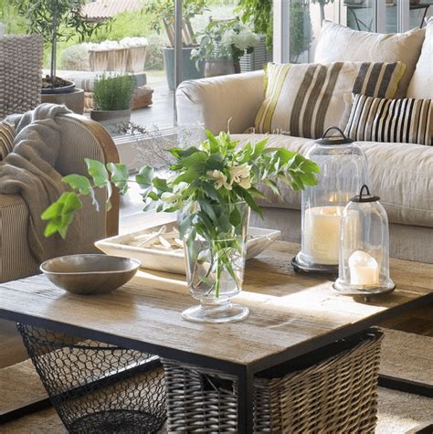 You need a place to put up your feet, put down drinks, and most importantly, to anchor the room. 26 Stylish And Practical Coffee Table Decor Ideas | DigsDigs