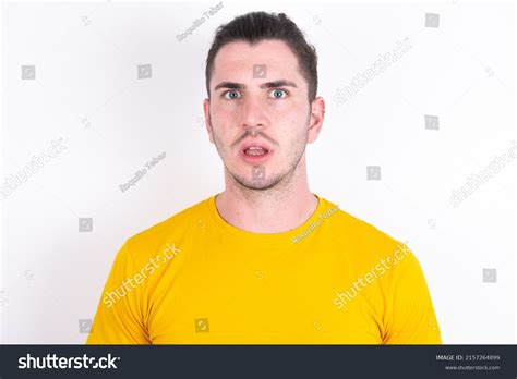 Shocked Young Caucasian Man Wearing Yellow Stock Photo 2157264899