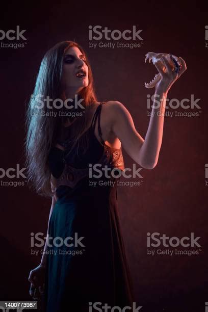 Dark Sorceress Casting A Magic Spell With An Animal Skull Stock Photo