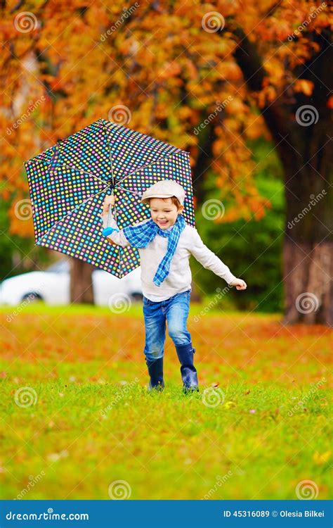 Happy Boy Enjoying An Autumn Rain In Park Stock Image Image Of Cute