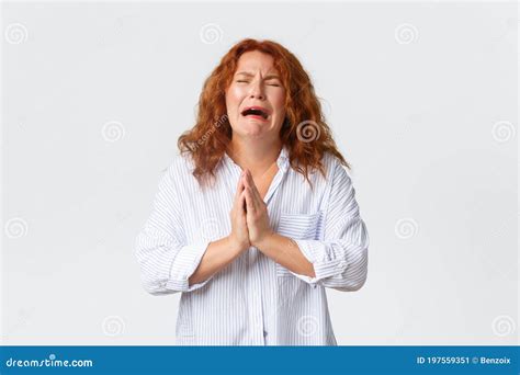 Desperate Crying Middle Aged Woman Pleading Begging For Help Or Supplicating Holding Hands In