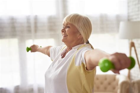 Premium Photo Senior Lady Dumbbells Exercise Workout At Home