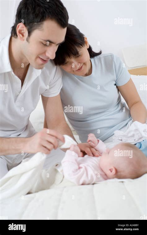 Man Changing Diaper Vertical Hi Res Stock Photography And Images Alamy