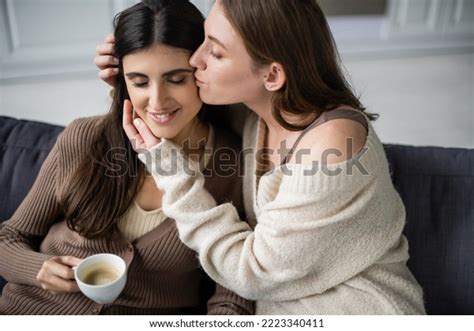 Lesbian Woman Warm Sweater Kissing Girlfriend Stock Photo