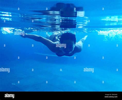 Woman Swimming Underwater Stock Photo Alamy
