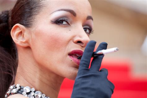 Beautiful Young Woman Smoking A Cigarette Stock Photo