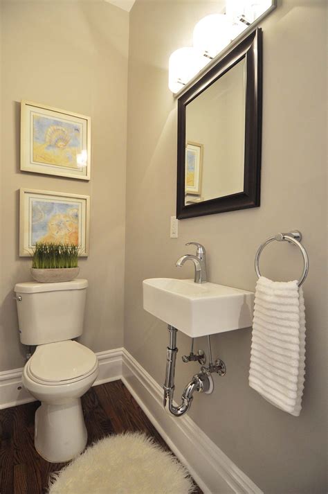 A Small Powder Room In A Turn Of The Century Home Has A Narrow Wall