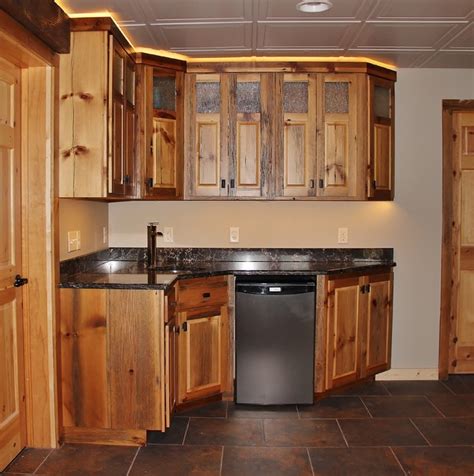 A dark and dingy basement is now the most popular area of this the design creatively uses reclaimed barnwood throughout the space, including. Barn Wood Kitchenette - Rustic - Basement - Minneapolis ...