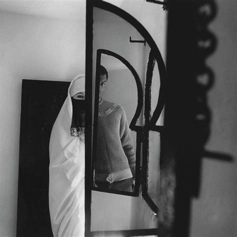 A Male Model Posing In A Mirror With A Woman Photograph By Chadwick
