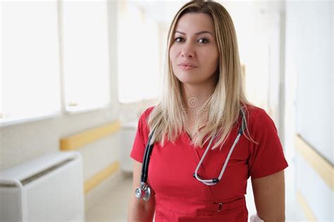 Portrait Of Young Female Doctor In Corridor Of Hospital Stock Photo