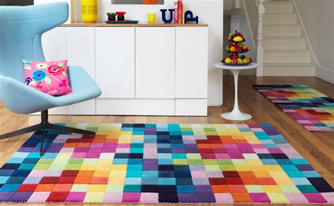 This area rug provides a pleasing backdrop for a variety of room styles. 18 Rooms with Colorful Rugs - Design Milk