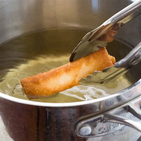 It is suggested to add some salt to get golden colour quickly and this is a very old tip being followed for so many years. Deep Frying (Dry-Heat Cooking Method) - Jessica Gavin