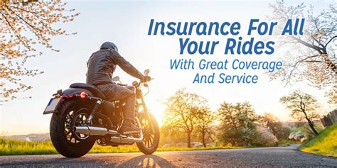 a man riding on the back of a motorcycle down a road with trees in the
