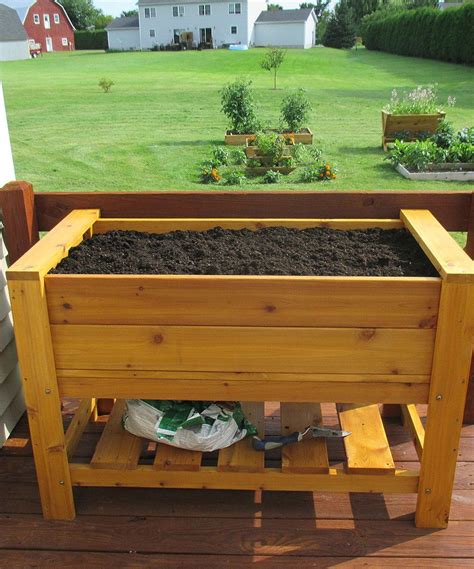 This elevated planter is basically just a simple box made of 2x6 and 2x4 cedar lumber attached horizontally around four vertical 4x4 cedar posts. This Elevated Garden Box by JFI Enterprises is perfect! # ...