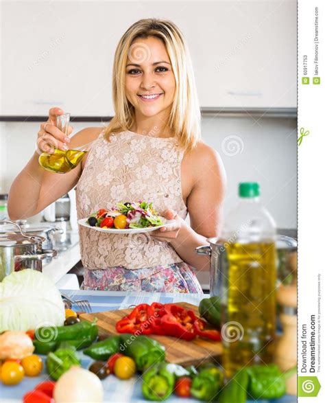 girl standing at kitchen table with plate of salad stock image image of natural diet 60917753