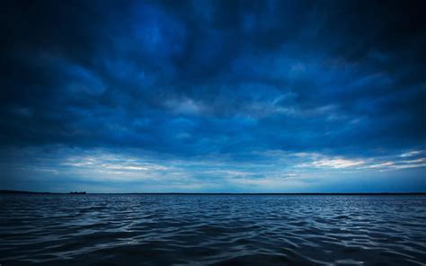 Blue Clouds Over Dark Blue Sea Hd Wallpaper Background Image