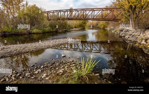 Metal Foot Bridge Spans Across The Boise River Stock Photo Alamy