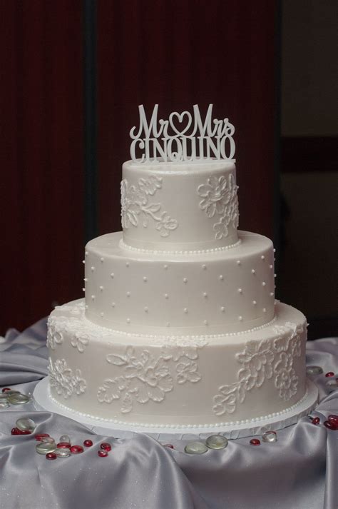 However, this can vary based on the shape of the cake. Three-Tiered White Buttercream Wedding Cake