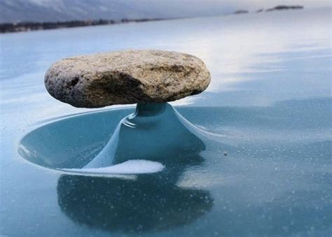 Sometimes Rocks On Frozen Lake Baikal Are Headed By The Sun Melting The Ice Underneath When