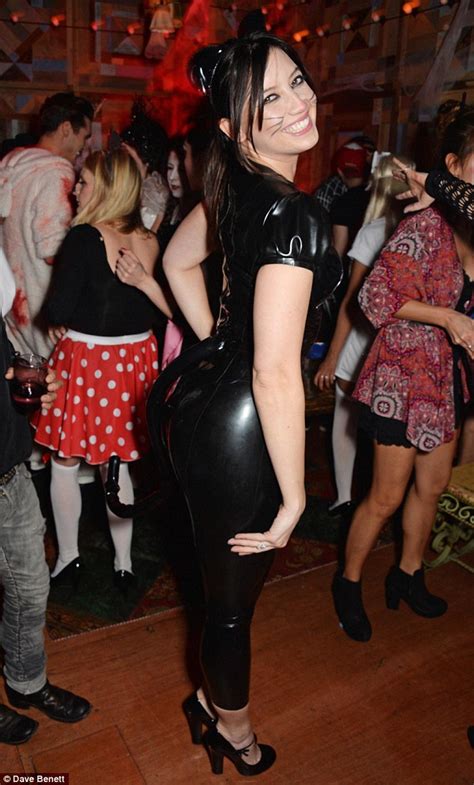 Daisy Lowe Displays Cleavage In Plunging Latex Catsuit At Halloween
