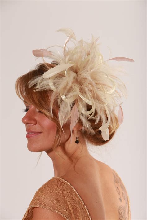 small cream satin fascinator hat with taupe nude feathers abbie maighread stuart millinery