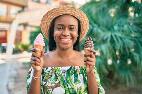 Young African American Tourist Woman On Vacation Smiling Happy Eating