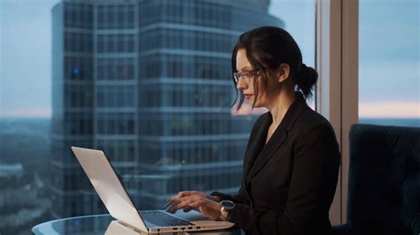 Portrait Of Business Woman With Glasses In The Office Girl Sitting At