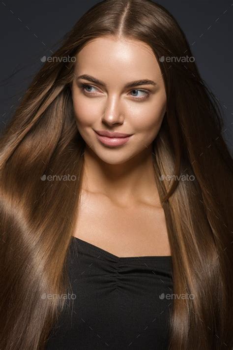 Brunette Woman With Long Hair Natural Tanned Skin Dark Background