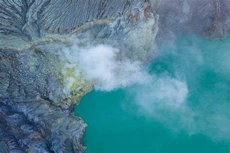 Aerial View Of Rock Cliff At Kawah Ijen Volcano With Turquoise Sulfur