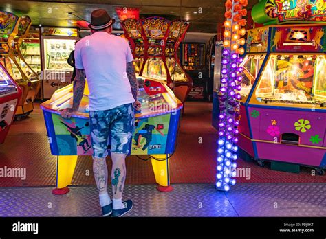 Brightly Coloured Funfair On Worthing Seafront In England Stock Photo