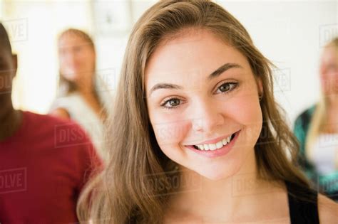 Close up of smiling face of teenage girl - Stock Photo - Dissolve