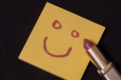 Smiley Face On Adhesive Note With Lipstick Stock Photo Download Image