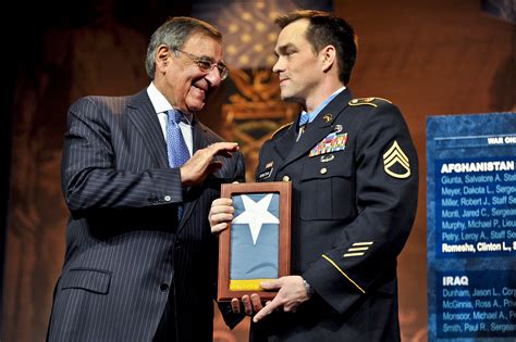 Defense Secretary Leon E Panetta Presents Former Army Staff Sgt