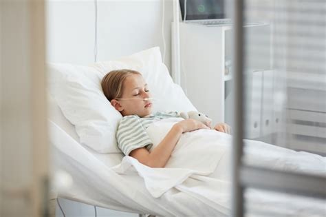 Free Photo Little Girl Sleeping In A Hospital Bed