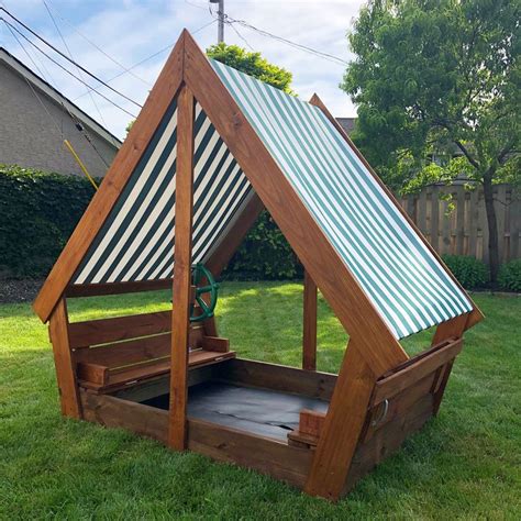 Diy Wooden Sandbox With Waterproof Overhang Covered To Keep The