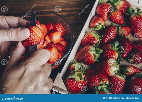 Hands Cutting Strawberries With A Knife Stock Photo Image Of Hands