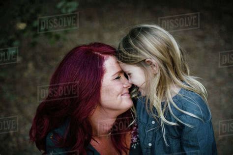Playful Mother And Babe Rubbing Noses Stock Photo Dissolve