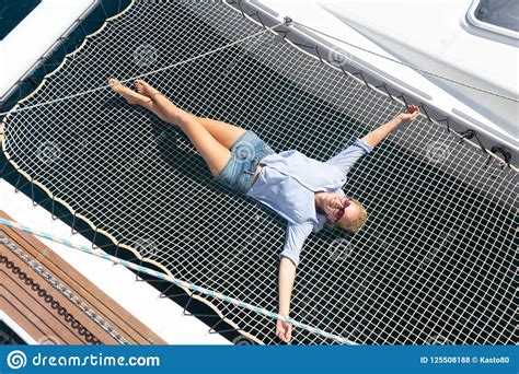 Woman Relaxing On A Luxury Catamaran Sailing Boat Stock Photo Image