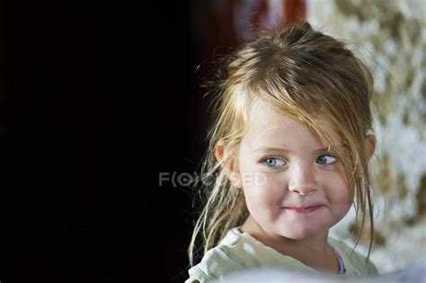 Close Up Portrait Of Cute Little Girl Smiling And Looking Away — Beauty