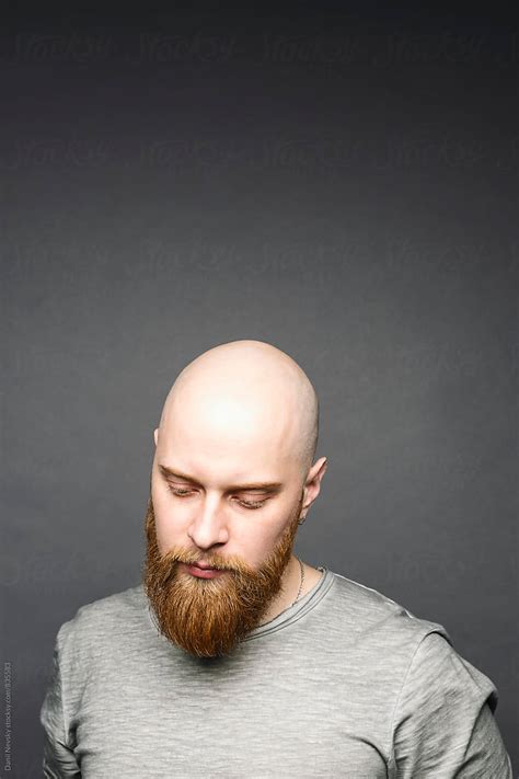 Portrait Of Bald Man With Red Beard Looking Down Del Colaborador De Stocksy Danil Nevsky