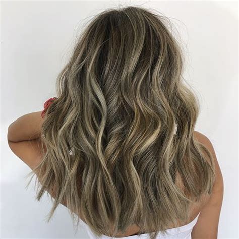 The hairstylist will separate the hair into multiple sections, put the hair color into the hair, and wrap it into a foil. Full Foil Highlights Dark Hair Brunettes | Full Foil ...