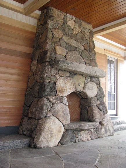 Boulder Stone Fireplace With Antique Granite Mantel And Curved Stone