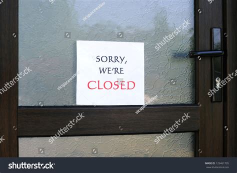 Sorry Were Closed Sign On The Front Door Of A Little Store Stock