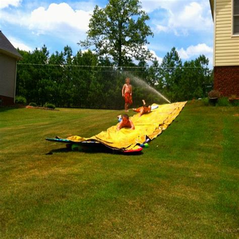 Tarp Slip N Slide With Baby Oil And Boggy Boards Put Noodles At Bottom For Pool Or Down Side