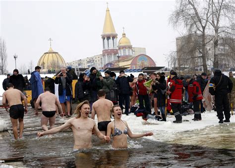 Orthodox Christians Bathe In Icy Waters To Mark Epiphany Daily Mail Online