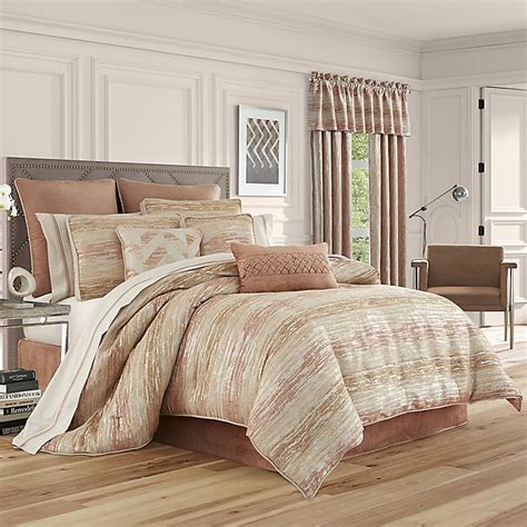 The set includes a bedspread and two shams, and it's available in full/queen or king/california king sizes. J. Queen New York™ Sunrise Comforter Set | Bed Bath & Beyond
