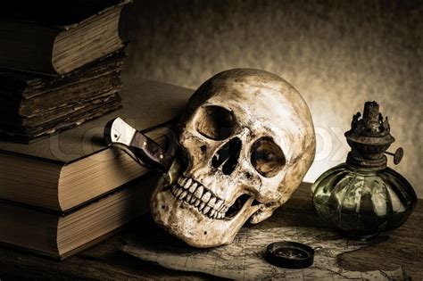 Still Life Human Skull With Knife In Stock Photo